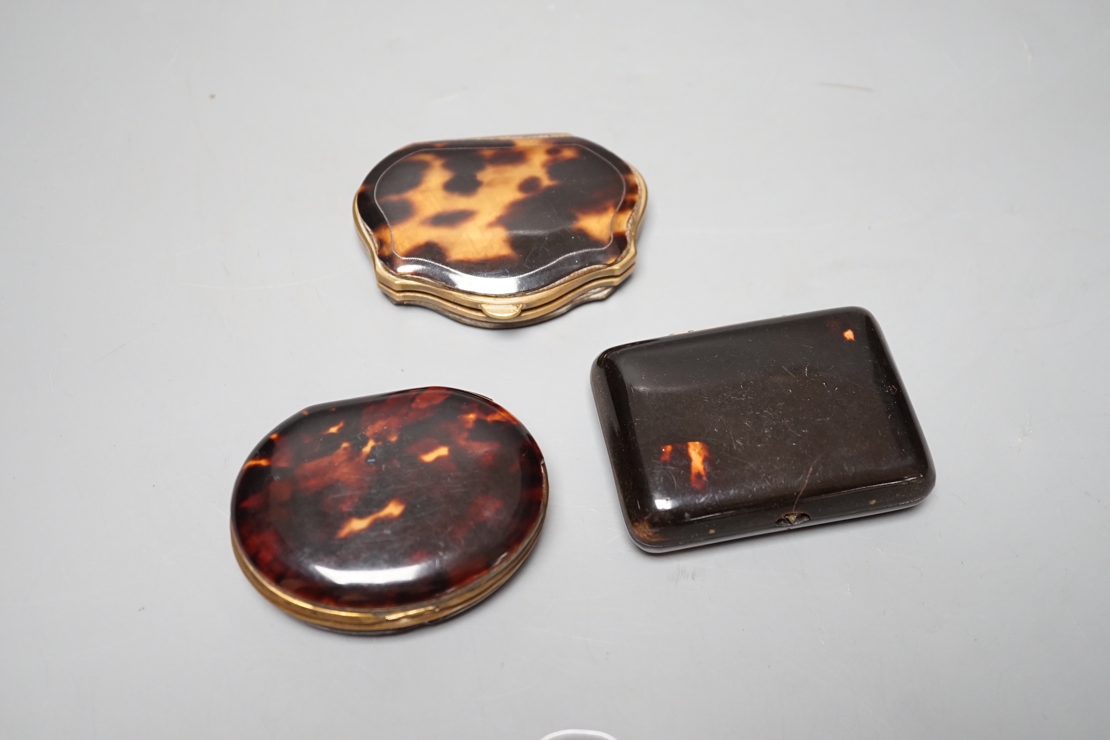 Three 19th century tortoiseshell and gilt metal purses